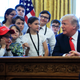 President Donald Trump talks to children in the Oval Office in celebration of "Bring Our Daughters and Sons to Work Day" at the White House in Washington, Thursday, April 26, 2018.